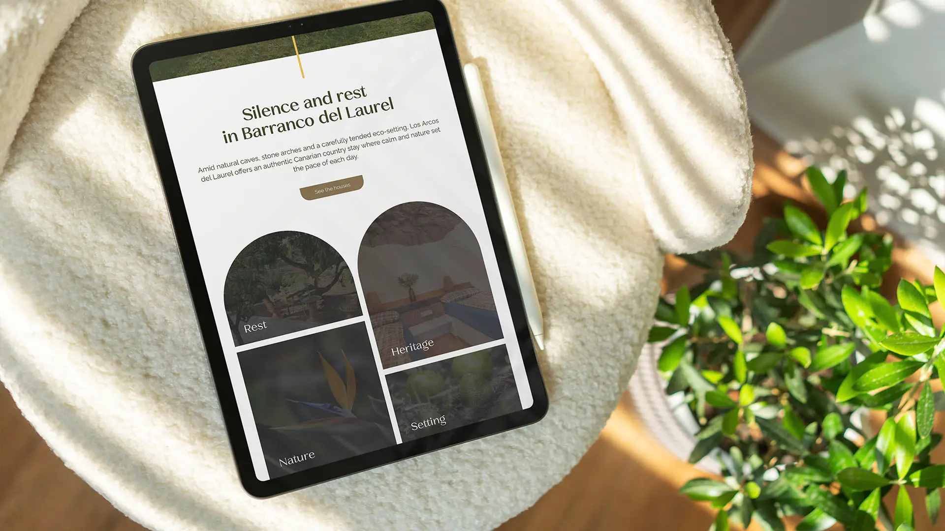 Tablet displaying the Los Arcos del Laurel website homepage with the headline "Silence and rest in Barranco del Laurel